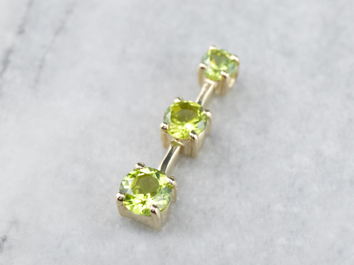 Graduated Three Stone Peridot Gold Pendant