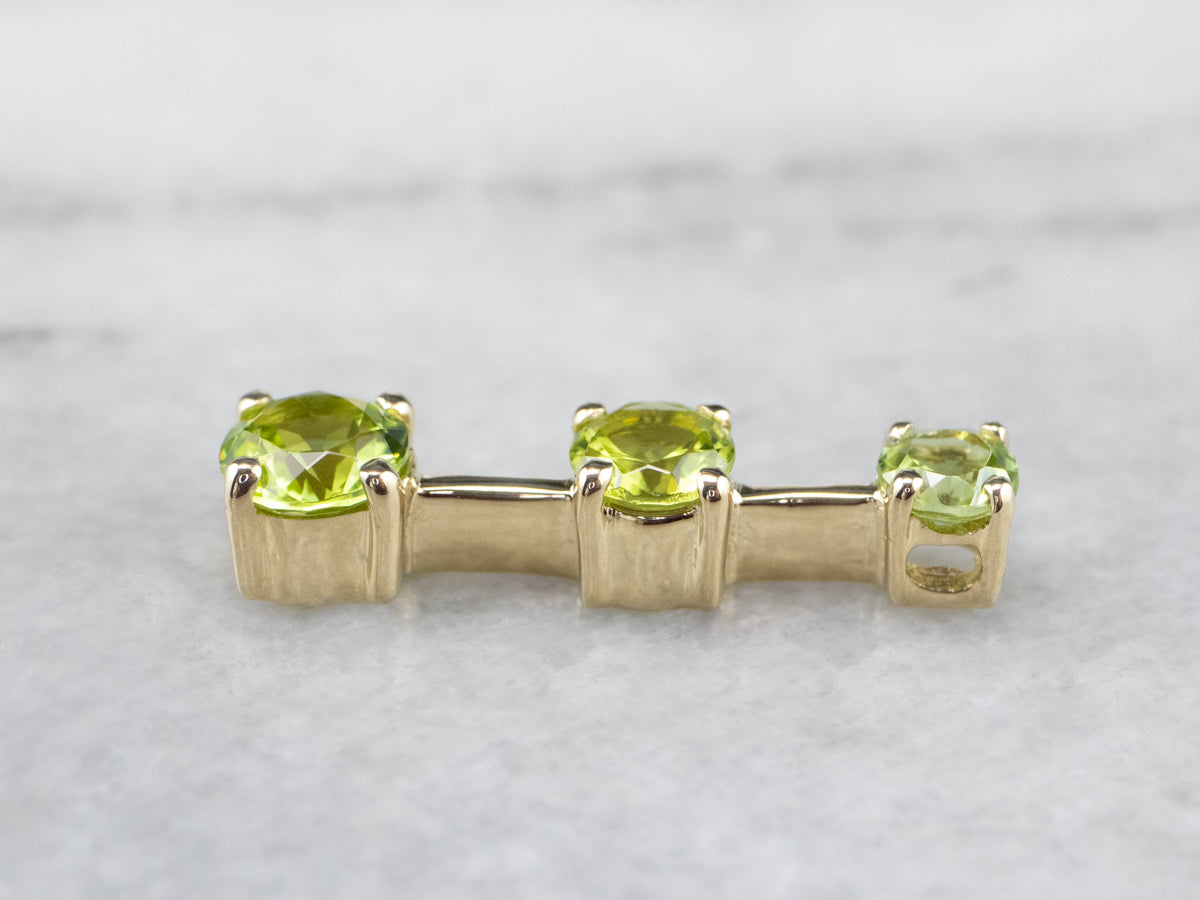 Graduated Three Stone Peridot Gold Pendant