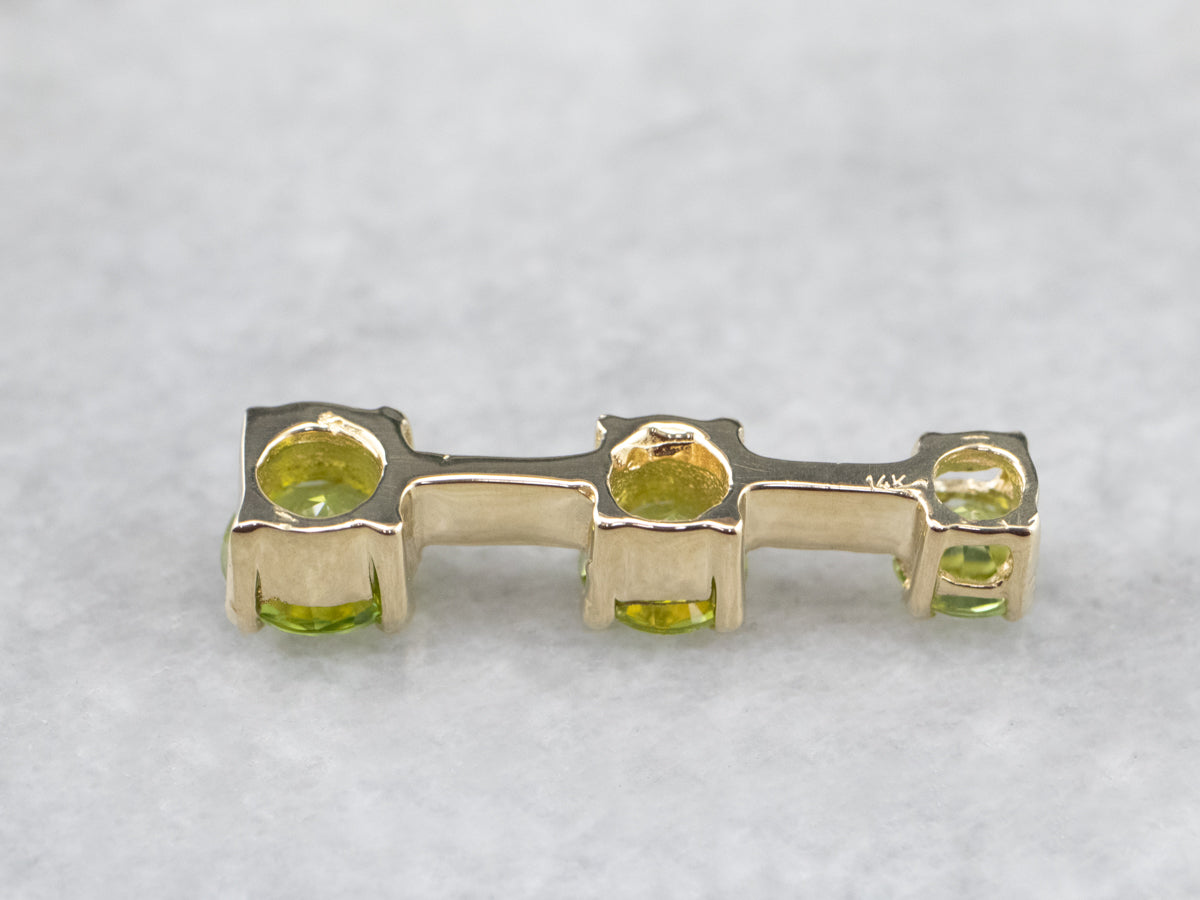 Graduated Three Stone Peridot Gold Pendant