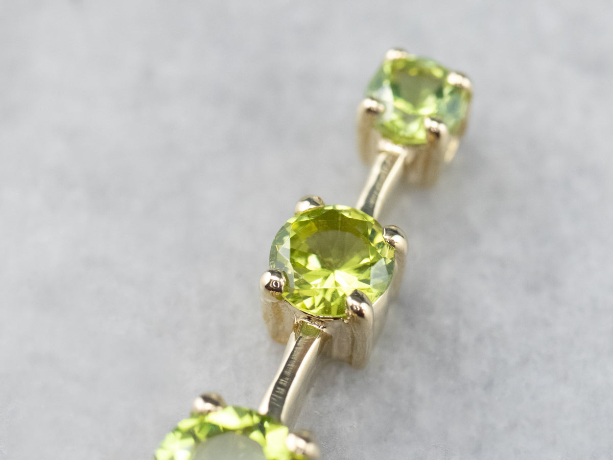 Graduated Three Stone Peridot Gold Pendant