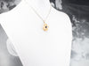 Gold and Pyrope Garnet Lovers Knot Pendant