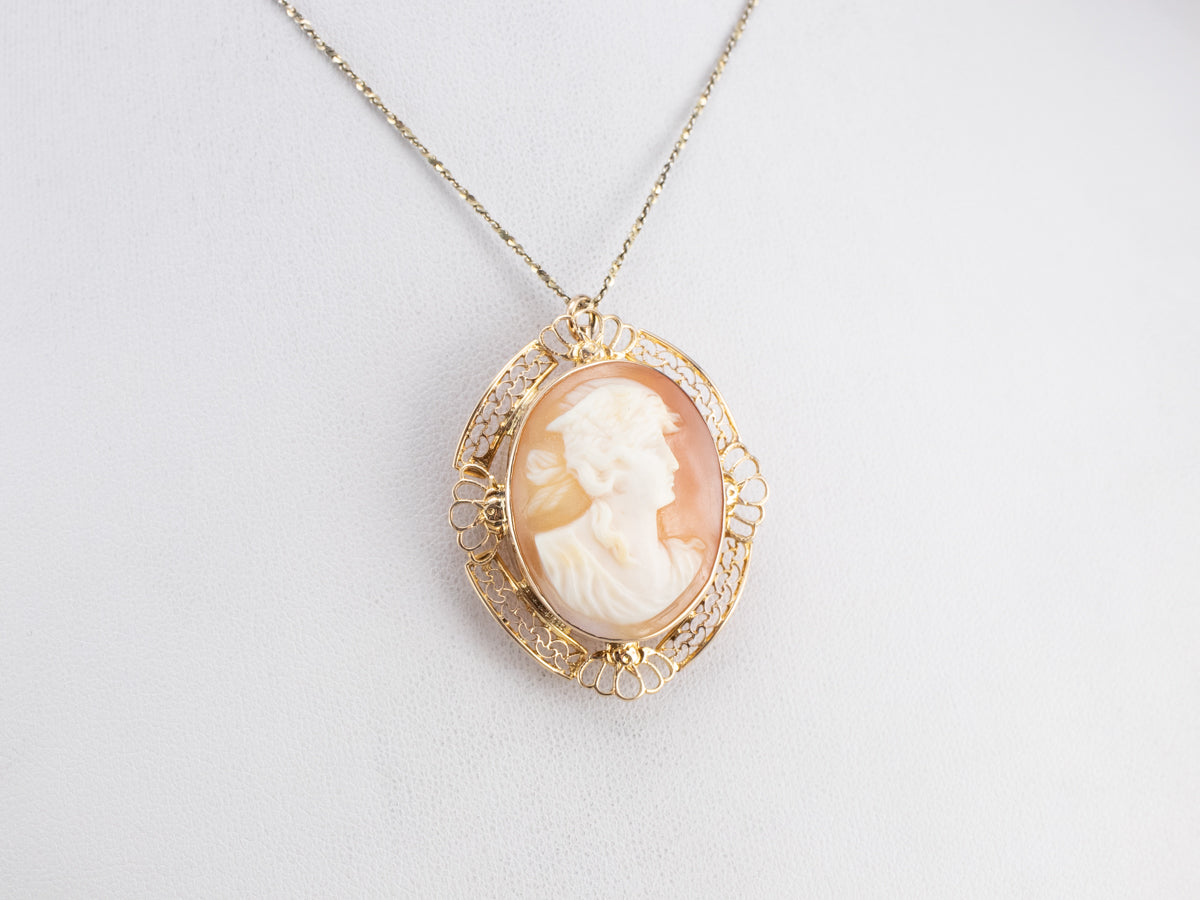 Broche o colgante de cameo de filigrana de oro vintage