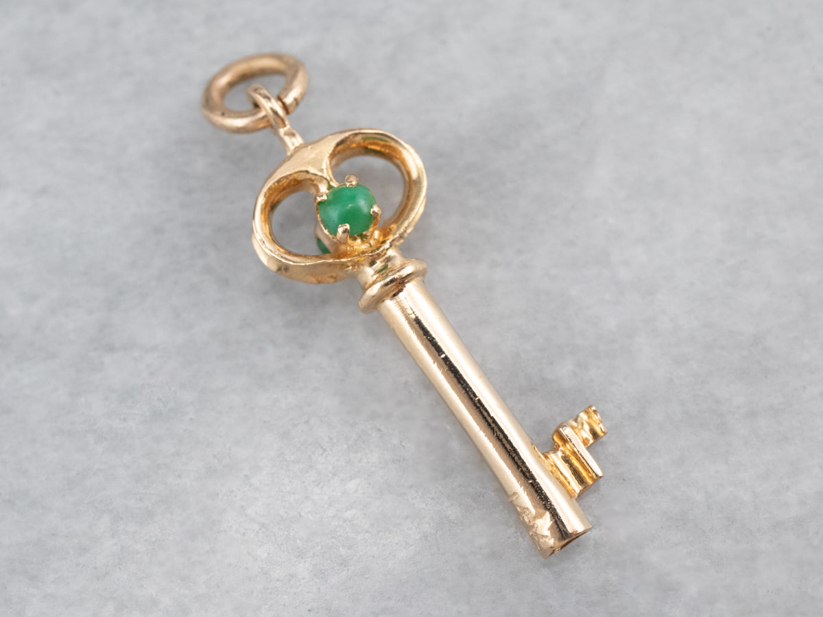 Gold Key Pendant with Green Glass Accents