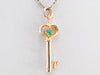 Gold Key Pendant with Green Glass Accents