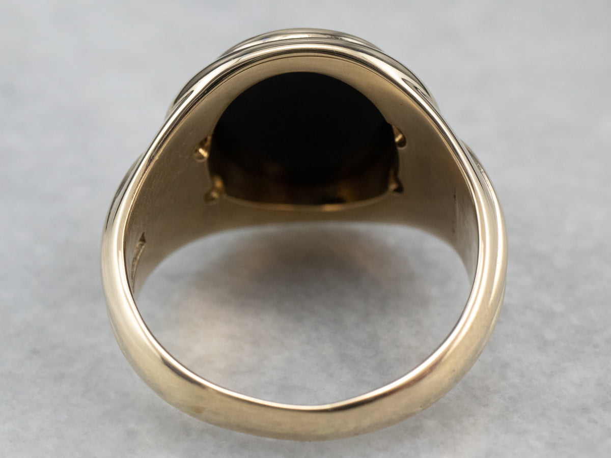 Anillo retro de oro con diamantes y ónix negro
