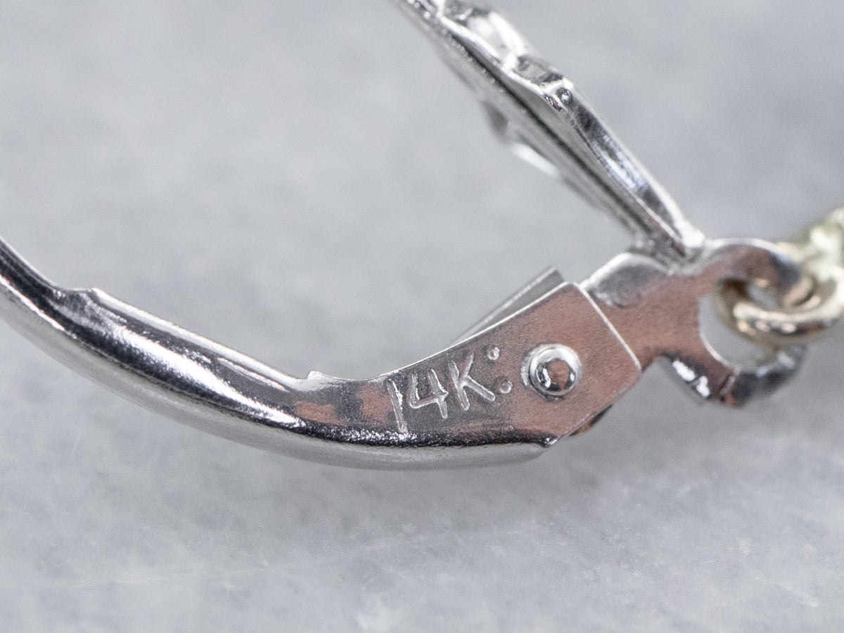 Pendientes colgantes de topacio azul en oro blanco