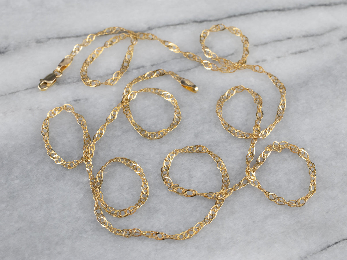 Cadena torcida larga de oro amarillo