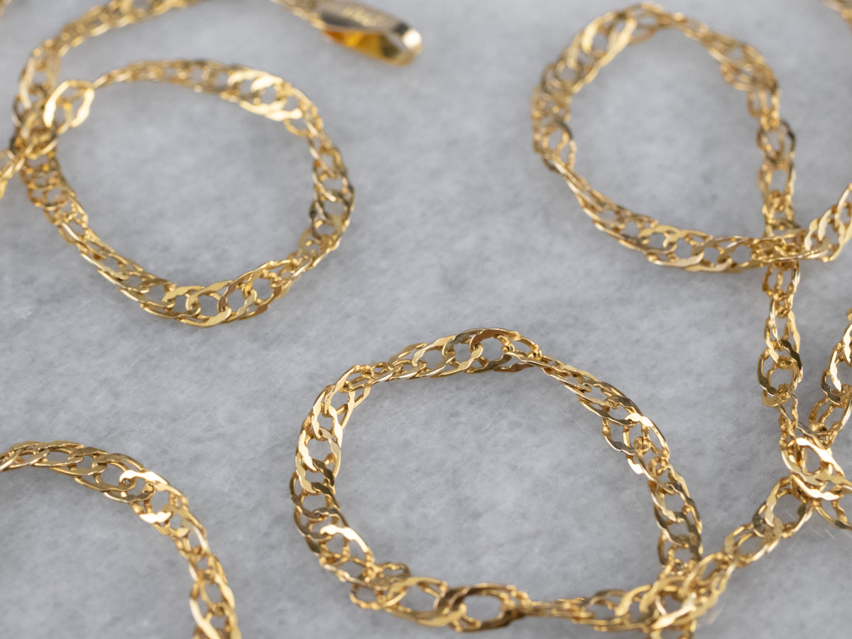 Cadena torcida larga de oro amarillo