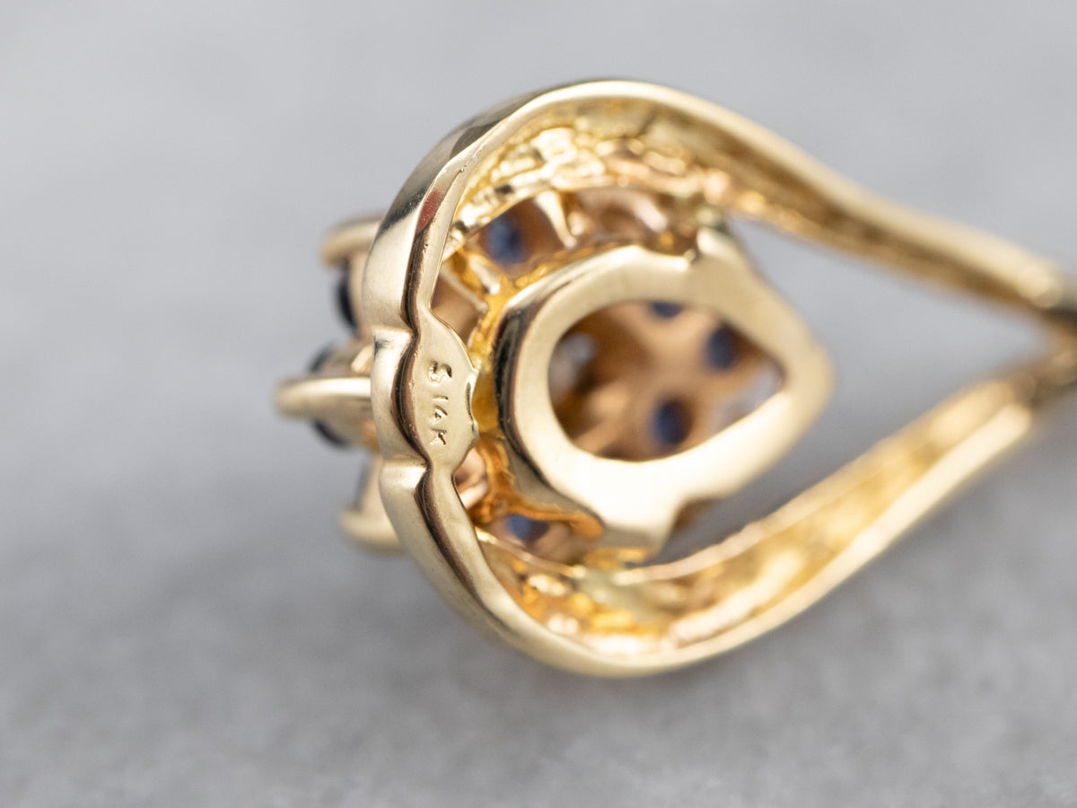 Colgante floral con halo de diamantes y zafiros