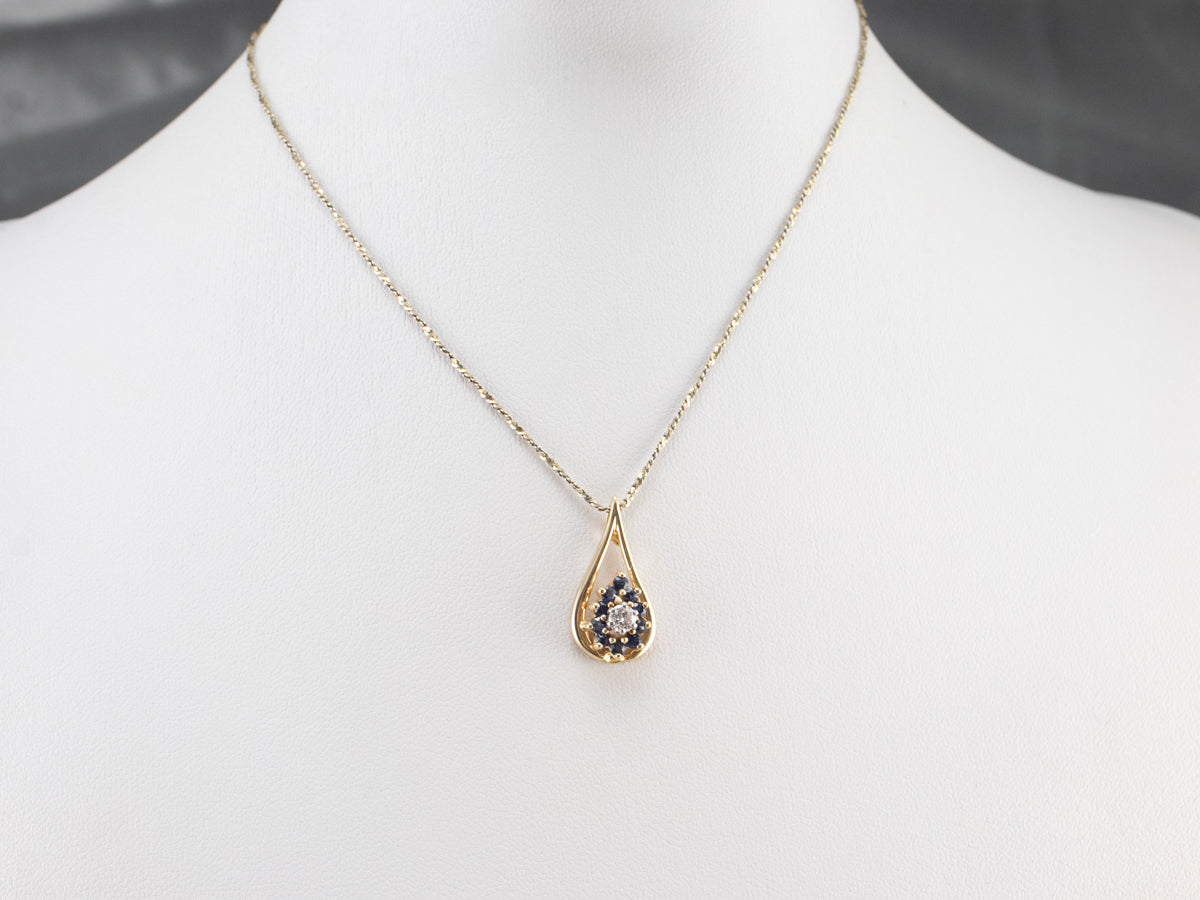 Colgante floral con halo de diamantes y zafiros