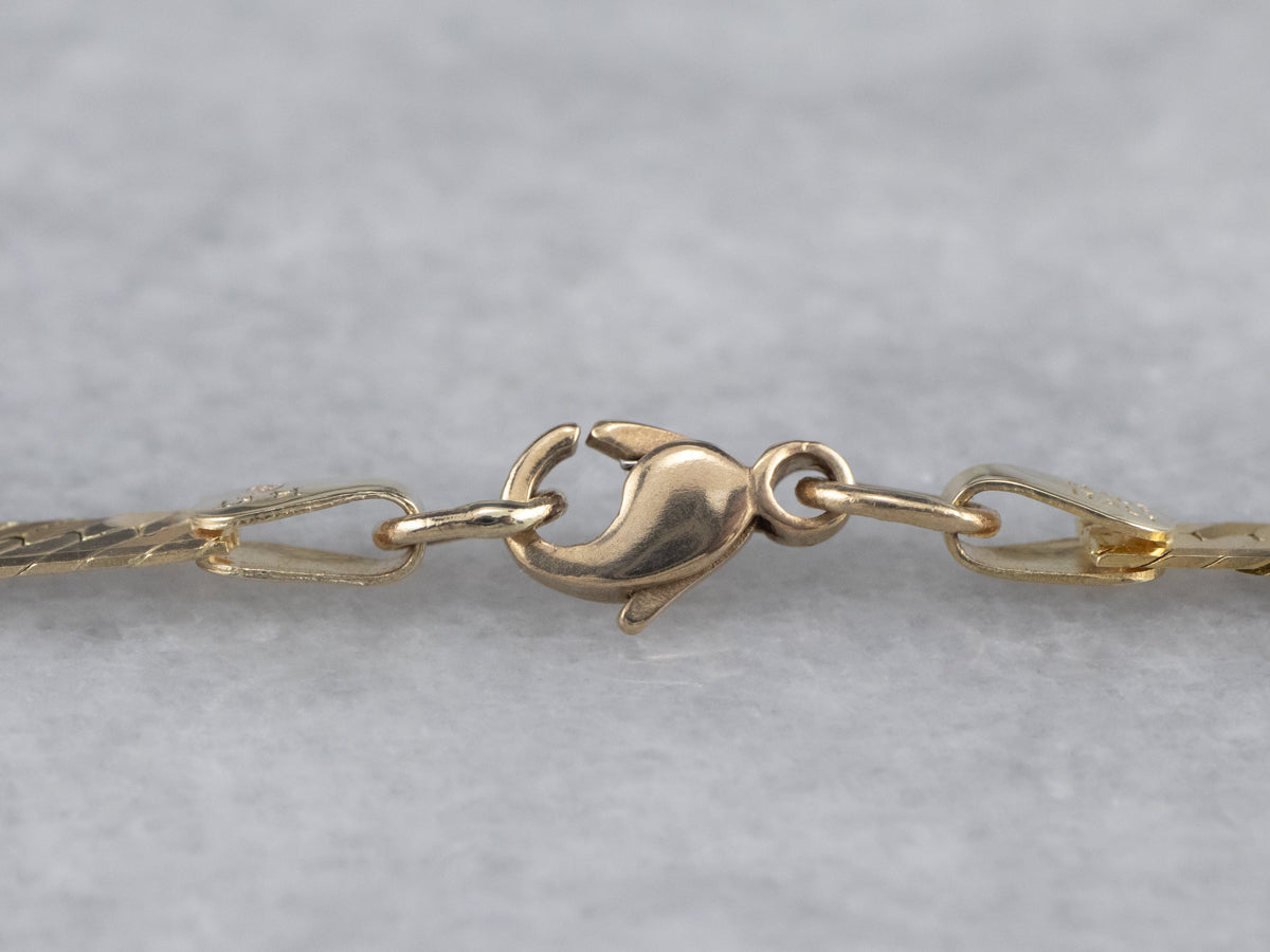 Cadena de espiga de oro de 14 quilates