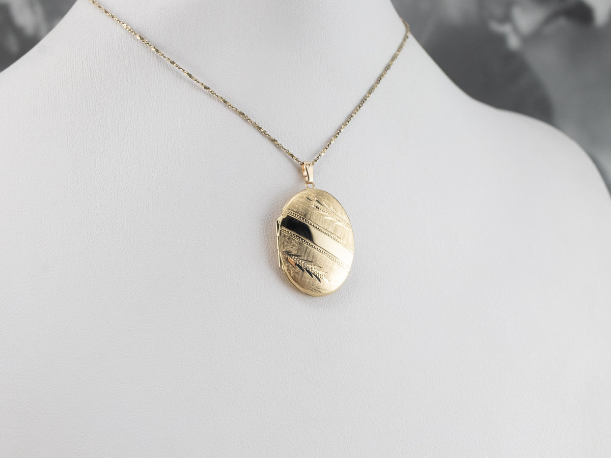 Engraved Oval Gold Locket Pendant