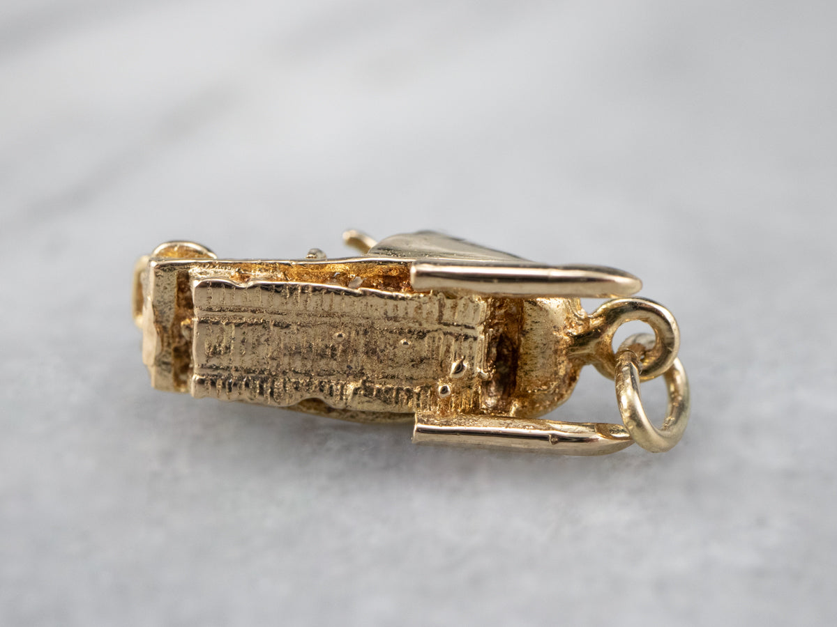 Charm de moto de nieve dorado