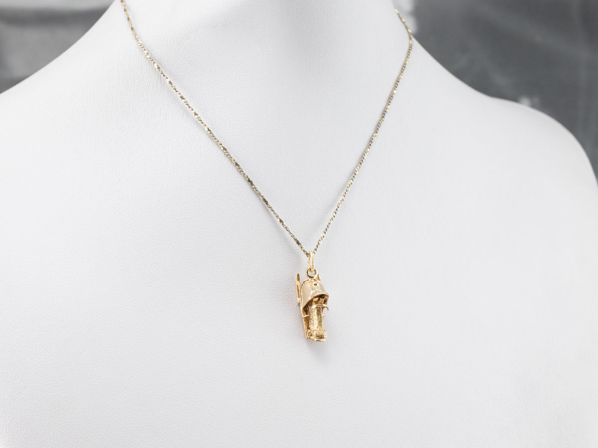 Charm de moto de nieve dorado