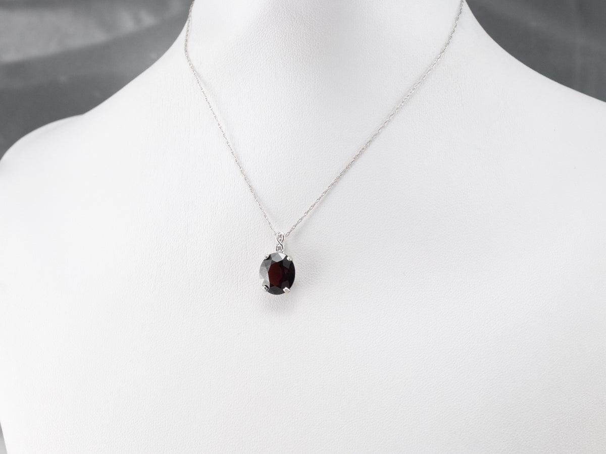 White Gold Garnet and Diamond Pendant