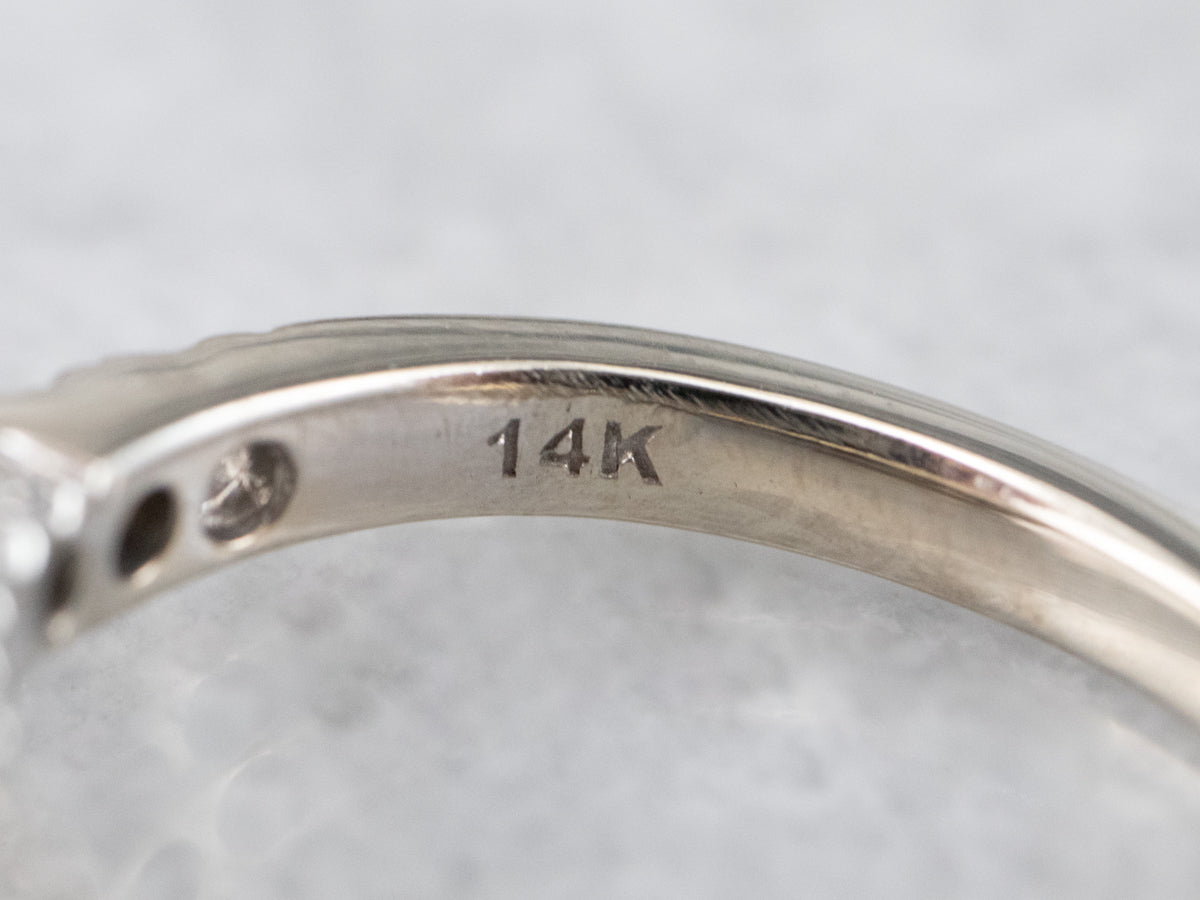 Modern White Gold Diamond Halo Engagement Ring