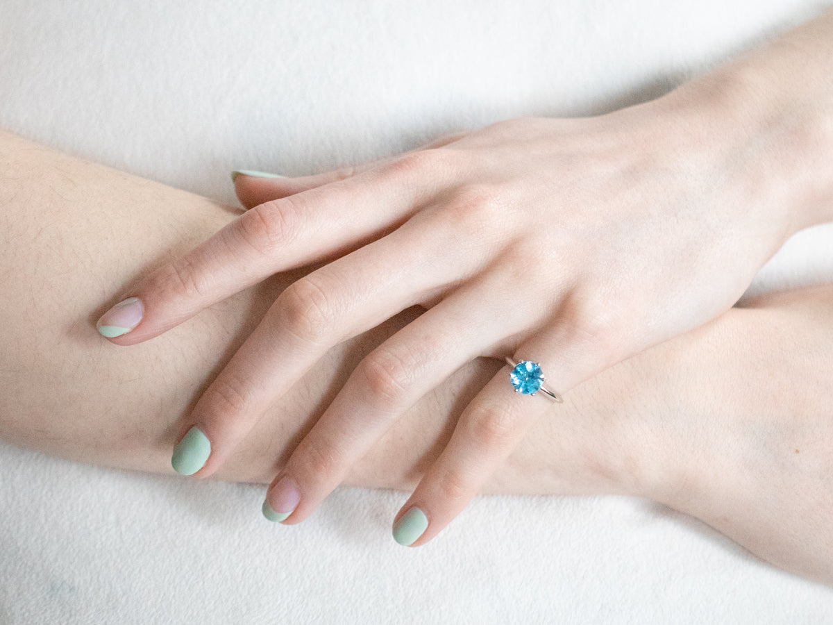 White Gold Blue Topaz Solitaire Ring