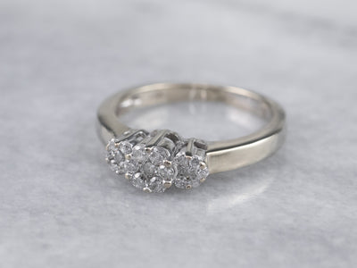 Three Diamond Halo Engagement Ring