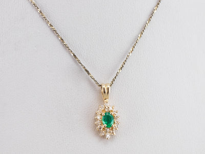 Gold Emerald and Diamond Halo Pendant