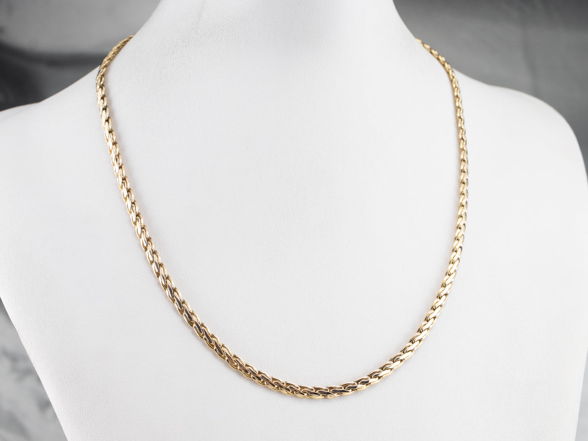 Cadena de eslabones tejidos en oro amarillo llamativo