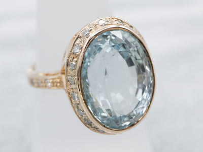 Natural Blue Topaz and Diamond Halo Ring