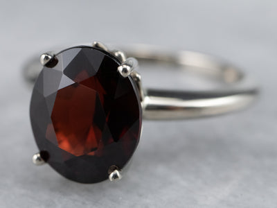 Sleek Garnet Solitaire Ring