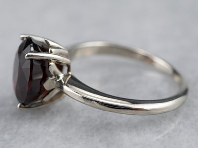 Sleek Garnet Solitaire Ring