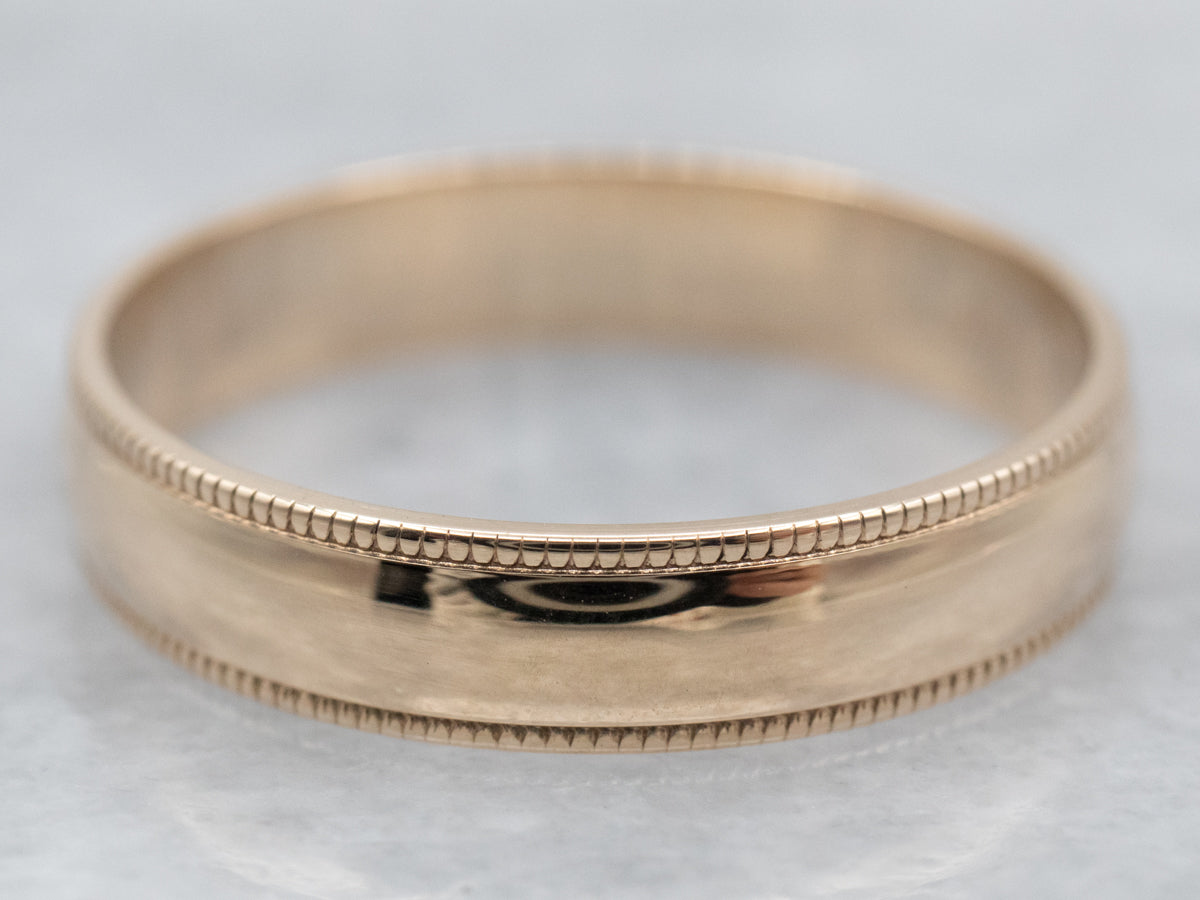 Anillo con banda con borde milgrain en oro amarillo de 10 quilates