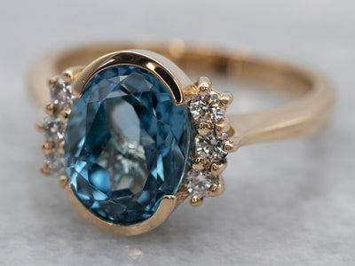 Sleek Gold Blue Topaz and Diamond Ring