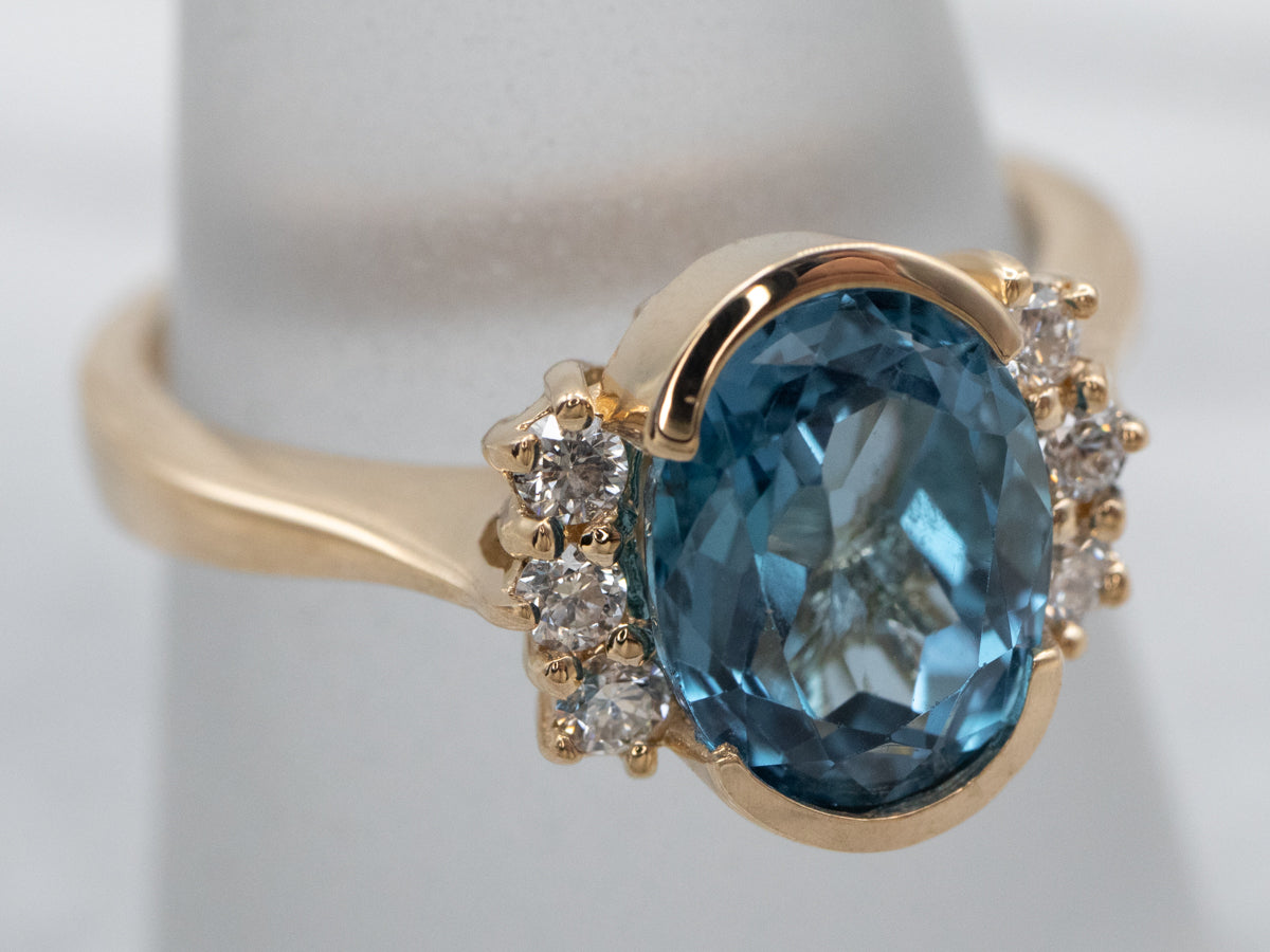 Cushion Swiss Blue Topaz and Diamond Halo Ring in 14k yellow gold (GR-6077)