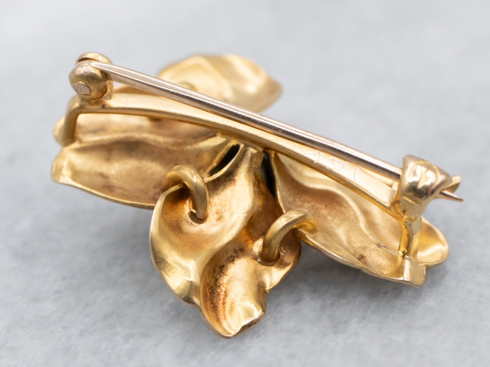 Broche de trébol de cuatro hojas con perlas negras