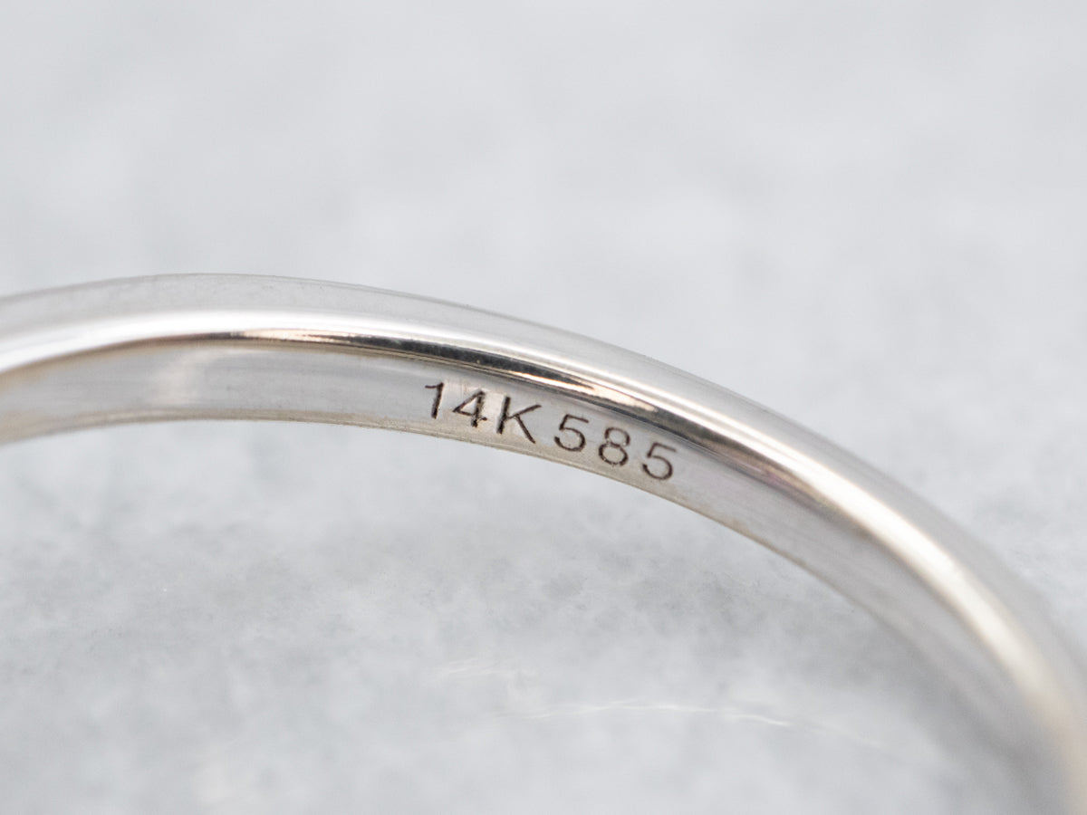 White Gold Ruby and Diamond Halo Ring