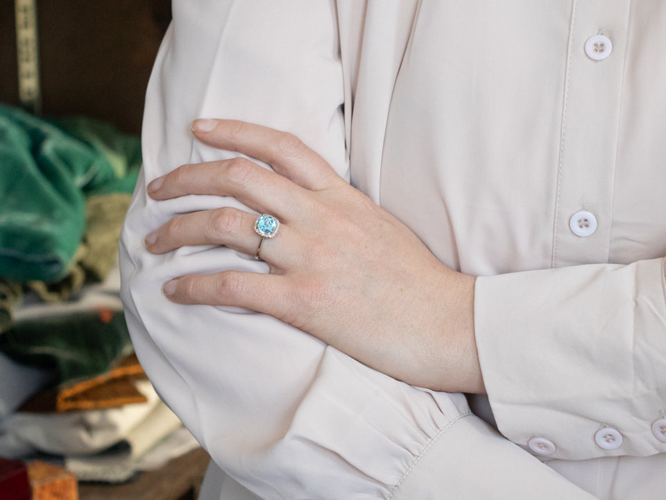 Modern Blue Topaz Diamond Halo Ring