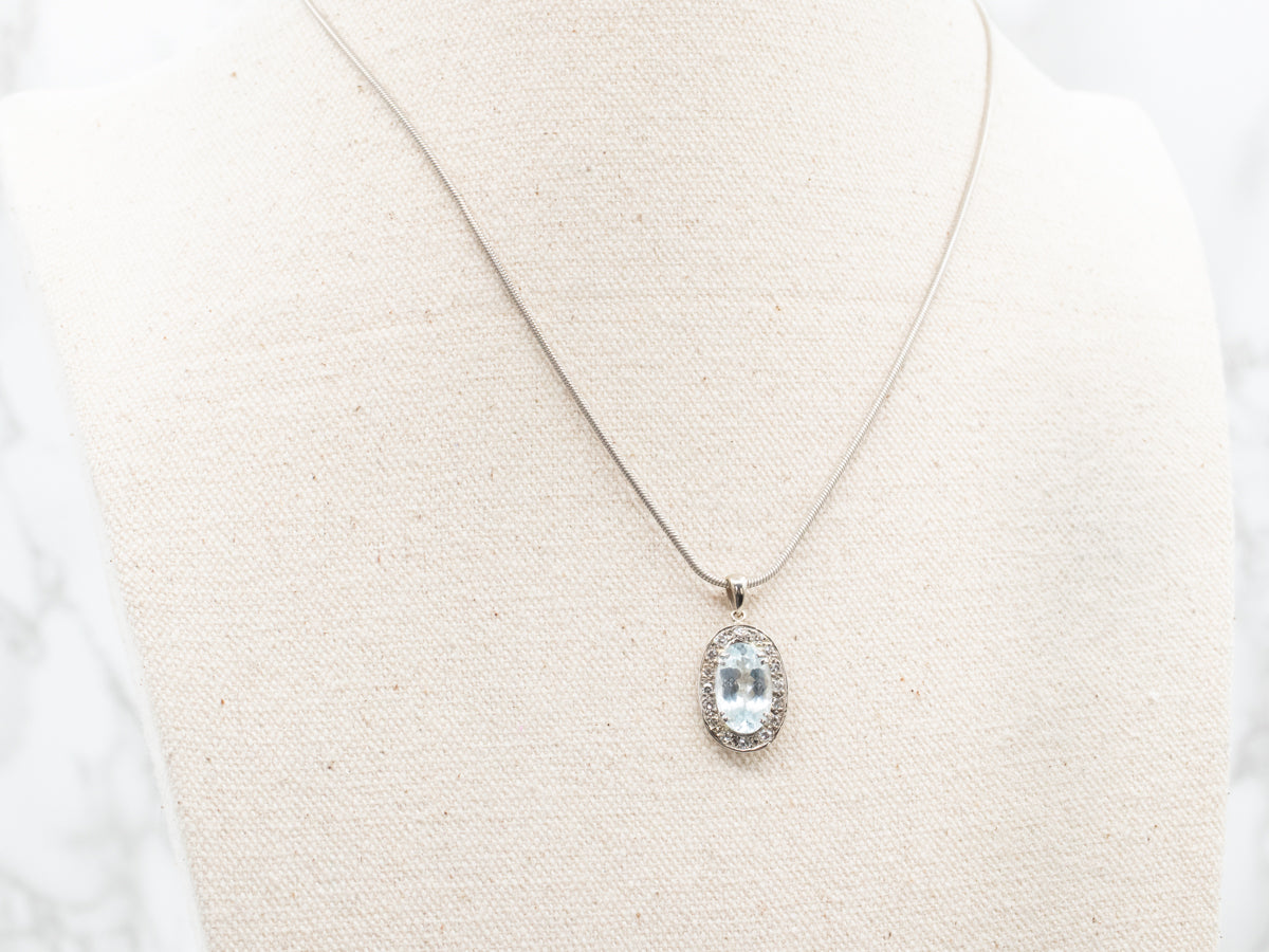 Alluring Blue Topaz and Diamond Halo Pendant