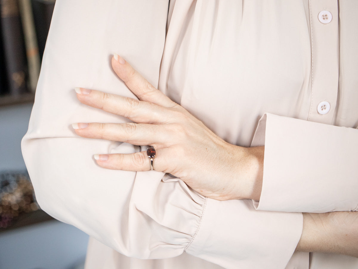 East-West Garnet Solitaire Ring