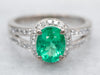 18-Karat Gold Emerald and Diamond Halo Ring