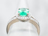 18-Karat Gold Emerald and Diamond Halo Ring