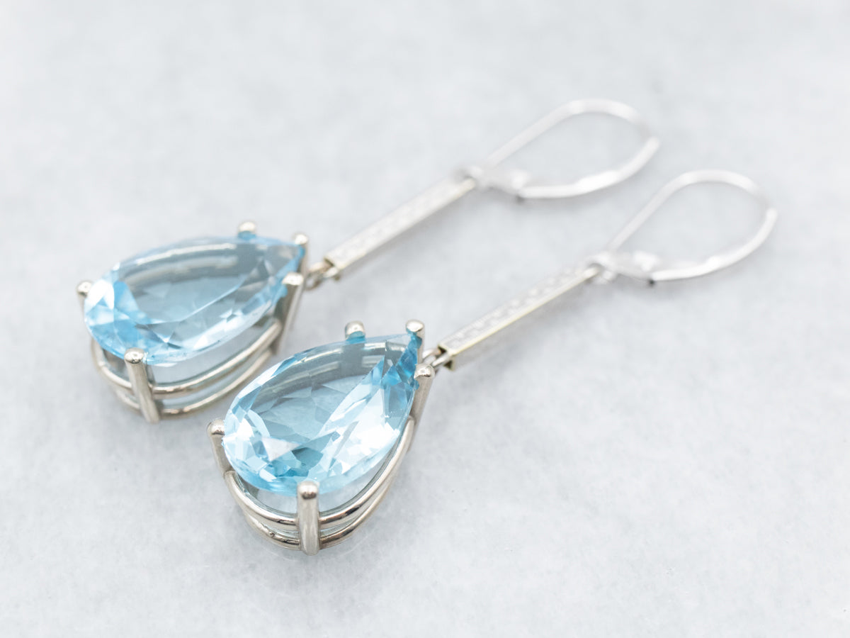 Pendientes colgantes de oro blanco con topacio azul