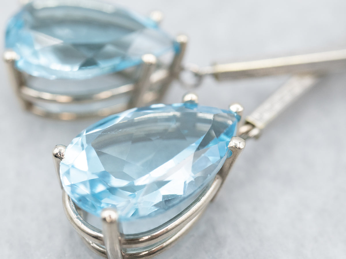 Pendientes colgantes de oro blanco con topacio azul