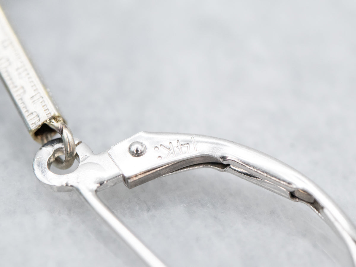 Pendientes colgantes de oro blanco con topacio azul