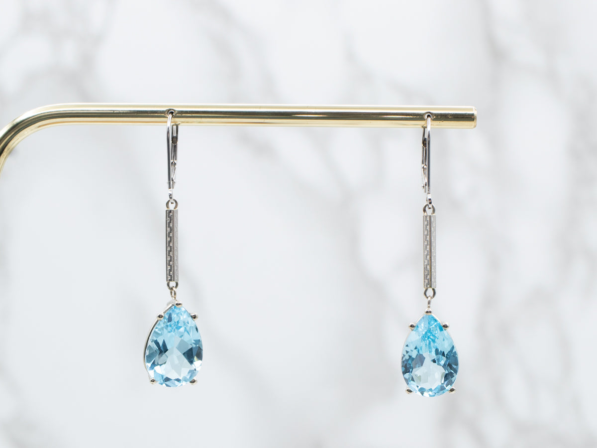 Pendientes colgantes de oro blanco con topacio azul