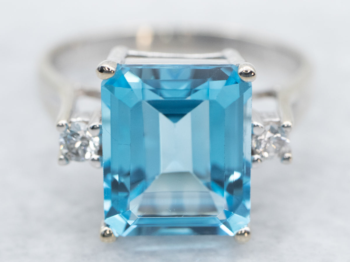 Luxurious Emerald Cut Blue Topaz and Diamond Ring