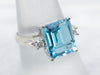 Luxurious Emerald Cut Blue Topaz and Diamond Ring