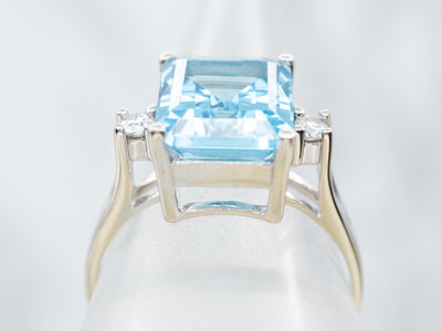 Luxurious Emerald Cut Blue Topaz and Diamond Ring