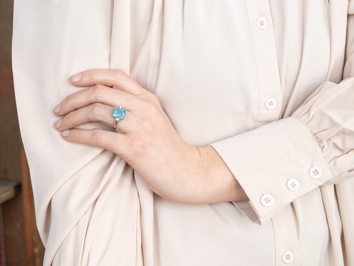 Luxurious Emerald Cut Blue Topaz and Diamond Ring