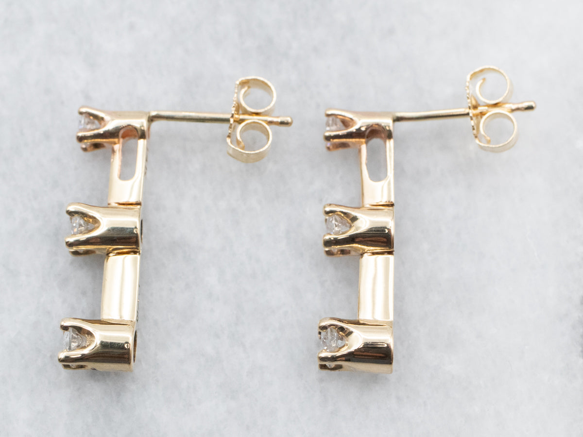 Pendientes colgantes de oro amarillo con tres diamantes