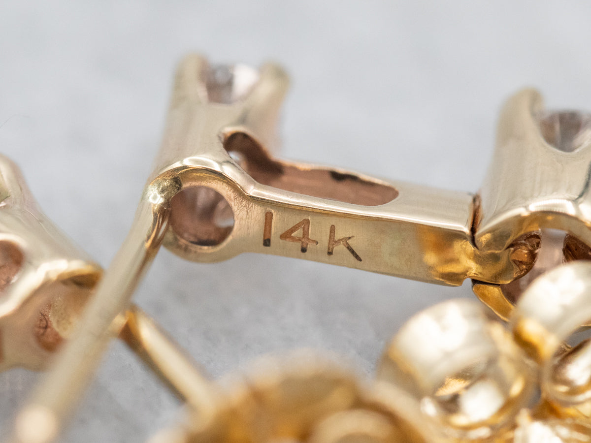 Pendientes colgantes de oro amarillo con tres diamantes