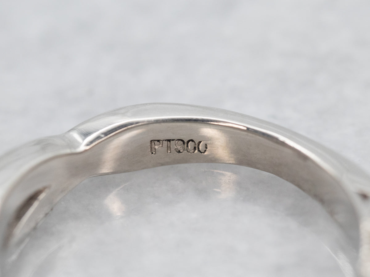 Twisting Platinum Sapphire and Diamond Ring