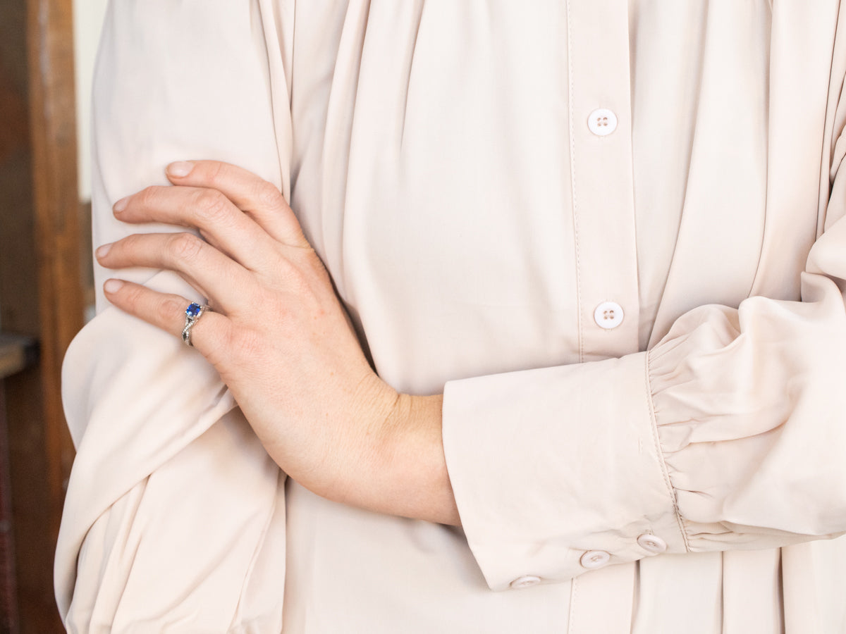 Twisting Platinum Sapphire and Diamond Ring