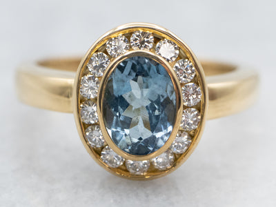 Gold Aquamarine and Diamond Halo Ring